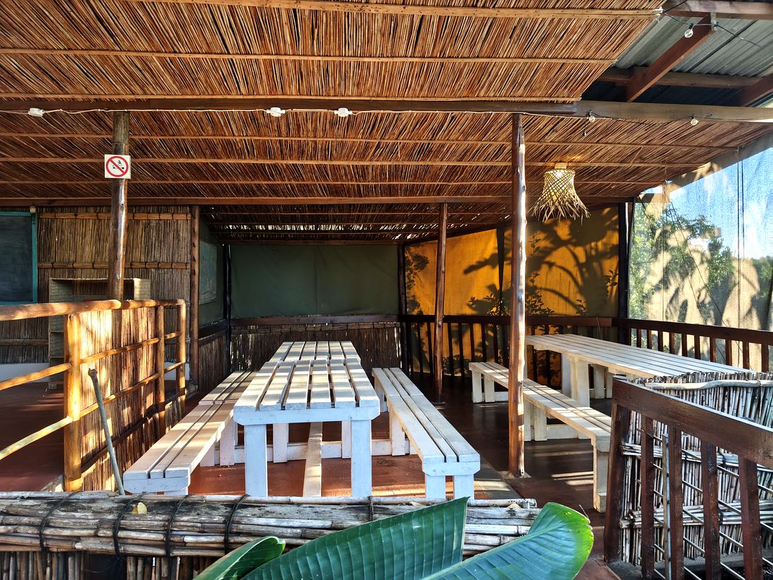 Open-air dining area with reed thatch ceiling